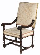 An early 18th century carved walnut and upholstered open armchair, Franco-Flemish, circa 1700-20 The