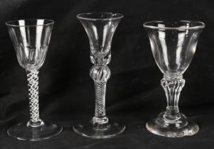 A Georgian air twist stem wine glass16cm high together with two further Georgian glasses, all with