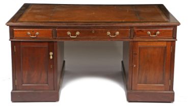 A 19th century mahogany partners desk, having a brown and gilt tooled leather top above three