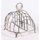 A George III silver toast rack, London 1810, maker Mary Troby, the pierced crescent handle with