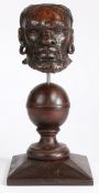 An early 17th century carved oak African male head mount, English, circa 1600-20 Designed with