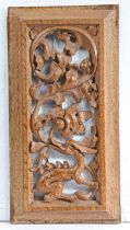 A 16th century carved oak panel Carved and pierced in high-relief, designed with dragon issuing