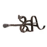 A rare and unusual wrought iron ‘branding’ socket candlestick, circa 1800 The rolled and flared