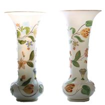 A pair of mid 19th Century Baccarat opaline glass vases, with raised polychrome floral decoration,