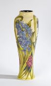A Moorcroft Hyacinth pattern vase, circa 2012, oviform, tubeline decorated with flowers on a cream