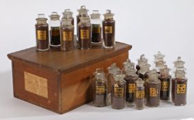 Wooden box containing eighteen glass bottles of Colman's Mustard seed samples, c.1870-1905. together