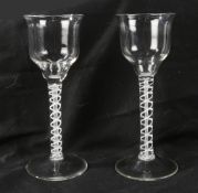 A pair of Georgian wine glasses, c.1760 the ogee bowls over an opaque twist stem 21cm high (2)