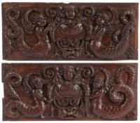 A pair of 17th century oak panels, dated 1662 Each designed with a pair of mermaids, centred by a