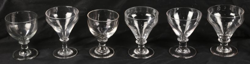 Six George III 'rummer' glasses, four with tapered bowl, height 14cm and two bucket shaped, height
