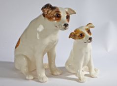 A pair of 'Winstanley' pottery Dogs, signed to underside, 32cm & 23cm high (2)