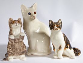 A group of three 'Winstanley' pottery seated Cats, stamped to underside, begging cat 25cm high,