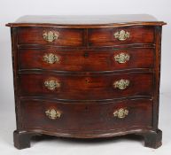 A good George III mahogany serpentine chest of drawers, the serpentine top above two short and three