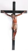 A good 17th century fruitwood and polychrome decorated Corpus Christi Mounted on a later cross, with