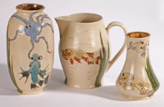 Group of three Burslem Pottery wares comprising two vases and a jug, Grotesque Fish decoration,