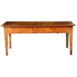 A 19th century French fruit wood farmhouse table, with a rectangular three plank top above a