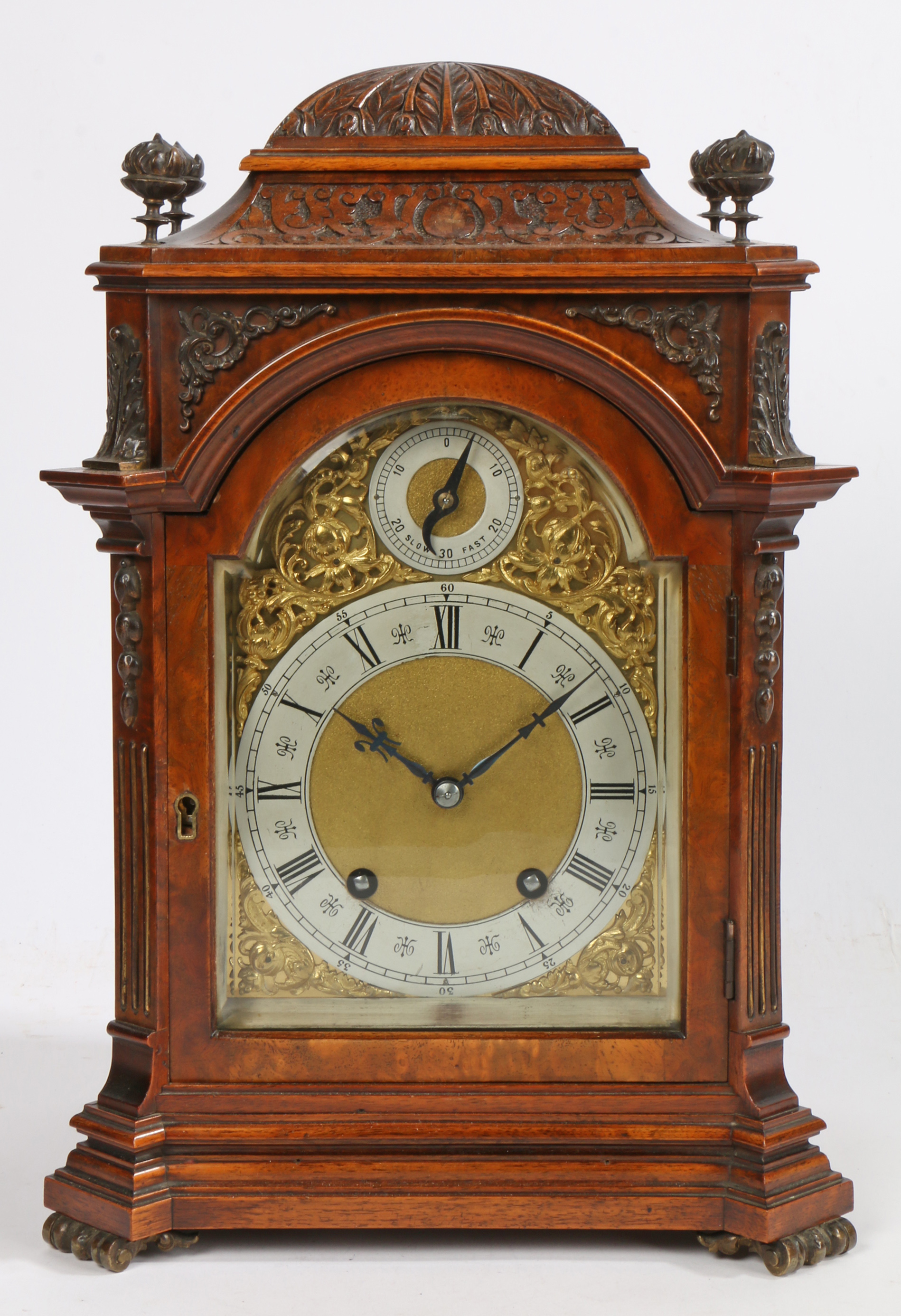 An early 20th Century walnut and brass mounted mantel clock, by Lenzkirch, No. 382379, the case with