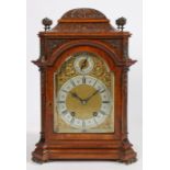 An early 20th Century walnut and brass mounted mantel clock, by Lenzkirch, No. 382379, the case with