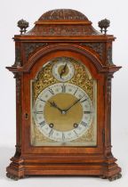 An early 20th Century walnut and brass mounted mantel clock, by Lenzkirch, No. 382379, the case with