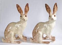 A pair of 'Winstanley' pottery Hares, signed to underside, 39cm high (2)
