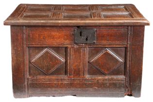 A rare Elizabeth I/James I oak table-chest, West Country, circa 1600-20 Having a six-panelled lid,