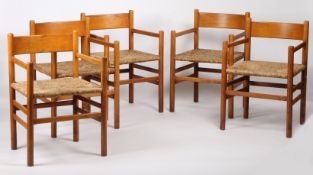 A Set of Five mid 20th century Scandinavian rush seated armchairs, having a curved slat back above