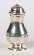 A George II silver pepperette, London 1731, maker Ralph Maidman, the pierced domed cover above a