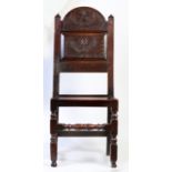 A Charles II oak backstool, Cheshire/Lancashire, circa 1670 With characteristic tall arched and