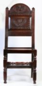 A Charles II oak backstool, Cheshire/Lancashire, circa 1670 With characteristic tall arched and