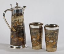 A Japanese Export Meiji period "shibayama" claret jug and beakers, having horn body's decorated with