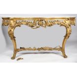 A George III parcel gilt and marble console table, the serpentine white marble top above a scroll,