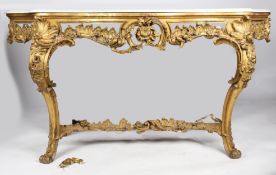 A George III parcel gilt and marble console table, the serpentine white marble top above a scroll,