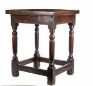 A Charles I oak centre table, circa 1630 Having an impressively thick one-piece top, the rails