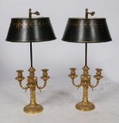A pair of gilt bronze ormolu Bouilotte Lamps with adjustable green tole shade and three candle arms,
