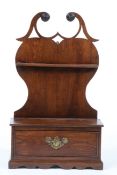 A George III cherrywood mural spoon rack The heart-shaped backplate with a fretwork broken swan-neck