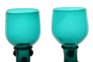 A pair of  English 18th Century green roemer glass, circa 1780, the cup with multi applied raspberry