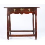 A small George I oak, fruitwood and walnut side table, circa 1720 The twin-plank ovolo-moulded top