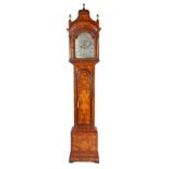 An 18th century Dutch walnut marquetry longcase clock with a later 19th century English arched