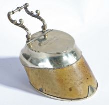 A Victorian horse hoof inkwell, having a silver plated horse shoe mount, scrolled pen holder and