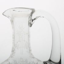 A Victorian English glass claret jug, possibly by Thomas Webb, finely engraved with leaves and