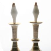 A pair of French mid 19th Century white opaline perfume decanters, circa 1850, with gilded ring