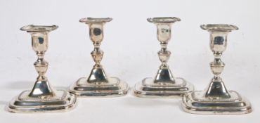 A set of four George V silver candlesticks, Sheffield 1918, maker William Hutton & Sons Ltd. the