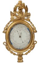 A Louis XVI style gilt Barometer, French, the frame set with an eagle with a quiver of arrows