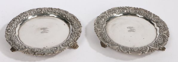 A pair of Portuguese silver dishes, Lisbon, maker S&V, with central crest depicting a bird of