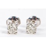 A pair of 18 carat white gold and diamond ear studs, the stones measuring 5.6 and 5.5mm diameter,