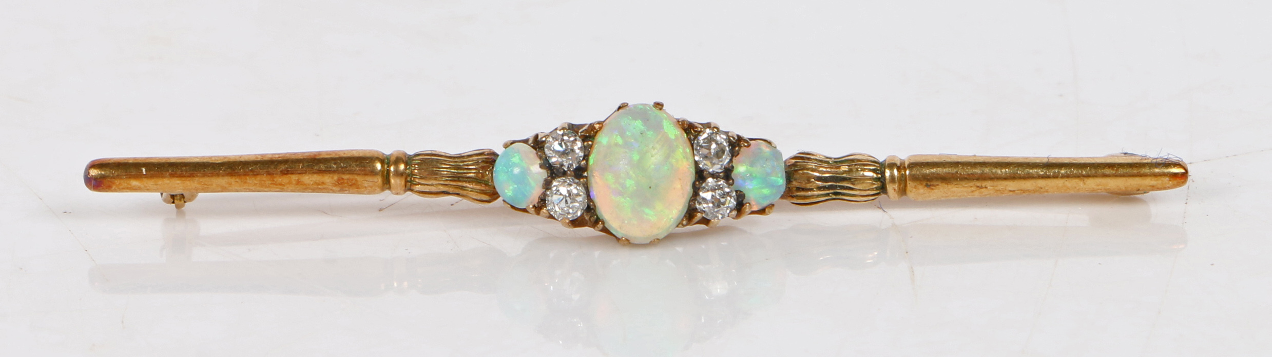 An 18 carat gold bar brooch set with a central oval opal flanked by four diamonds and a further - Bild 5 aus 6