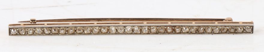 A diamond set bar brooch, the bar set with thirty old cut diamonds, 66.1mm wide, 3.9g