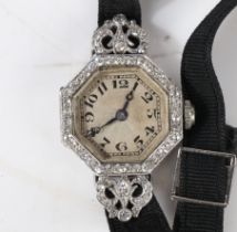 A French platinum and diamond set cocktail watch, the white engine turned dial with Arabic numerals,