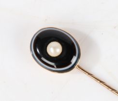 A yellow metal, banded agate and pearl set stick pin, the head set with an oval banded agate centred
