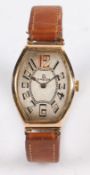 An Omega gold plated Art Deco wristwatch, of oval cushion form, the signed silver dial with Arabic
