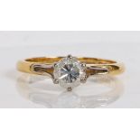 An 18 carat gold and diamond solitaire ring, the single round brilliant cut diamond at 0.68ct